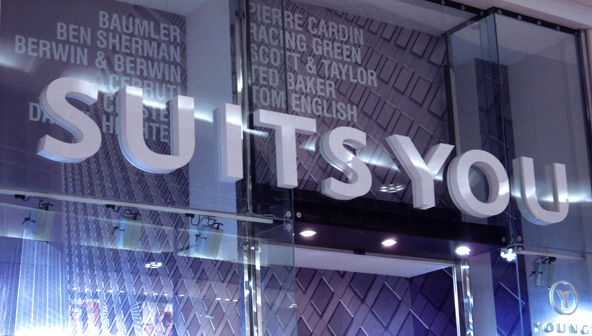 Retail brand identity on fascia of two storey glass store front